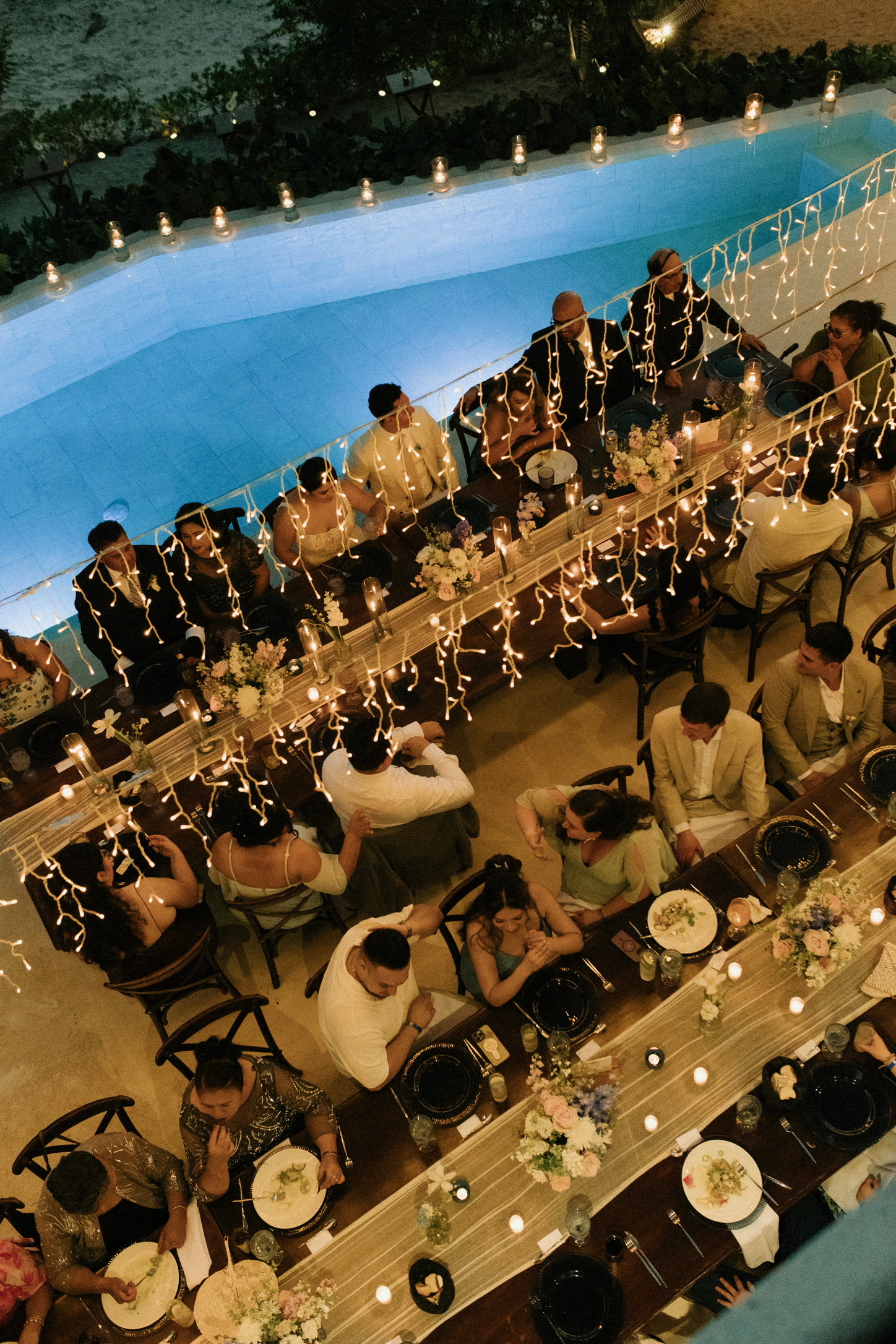 Wedding dinner beside the pool at night